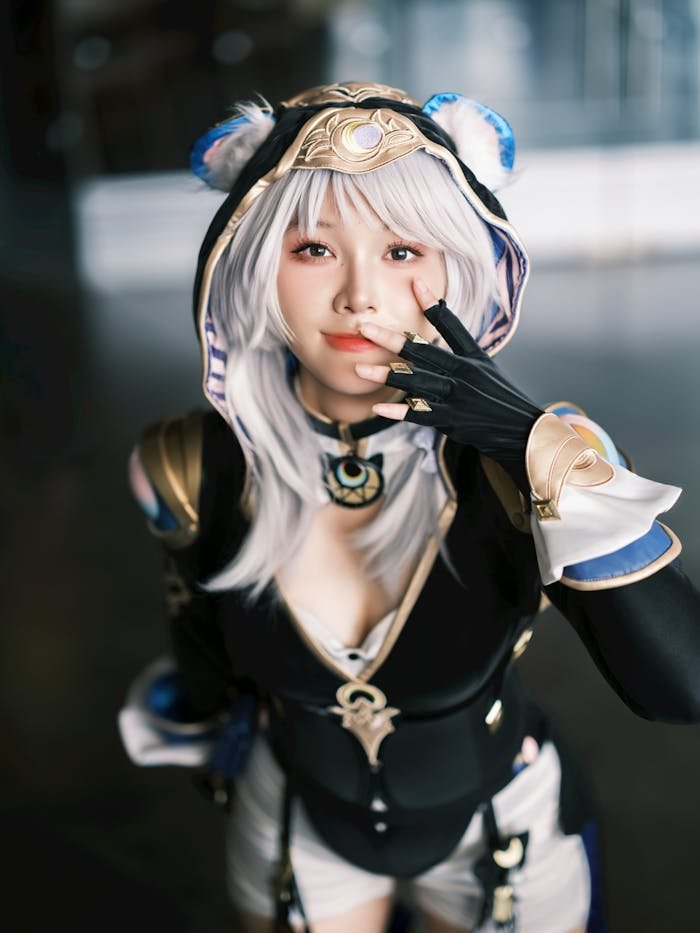 about-04 Cosplay enthusiast posing in a detailed fantasy costume indoors.